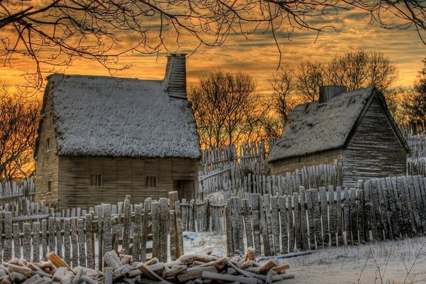 Winter village landscape at sunset