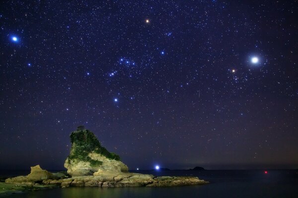 Hill on the background of the night starry sky