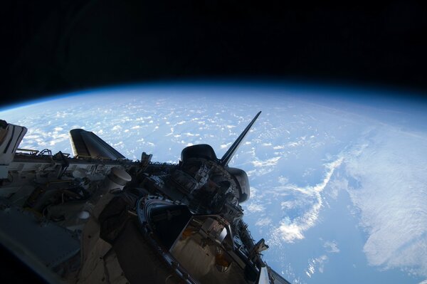 The space shuttle is approaching the earth