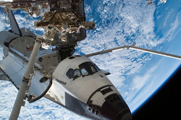 Space shuttle in outer space in orbit