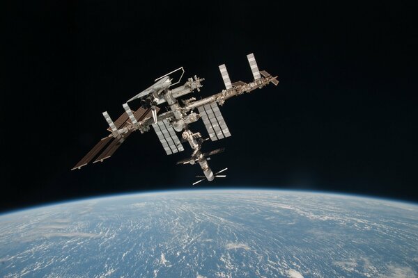 The ISS is a satellite in space. View of the Earth