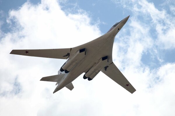 TU-160 fighter lovno white swan in the clouds