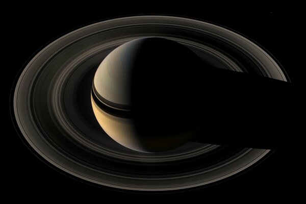 The planet Saturn with its satellites
