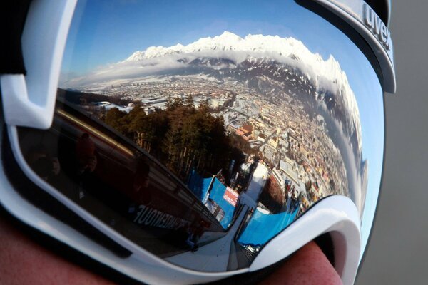 Reflection of the springboard of the Austrian Alps in glasses