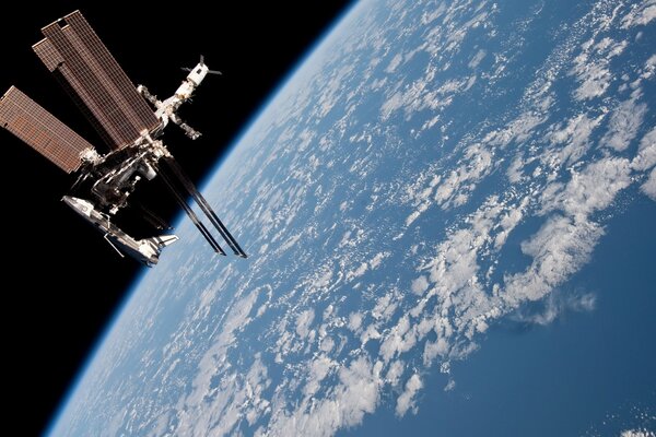 The ISS is flying in orbit around the planet