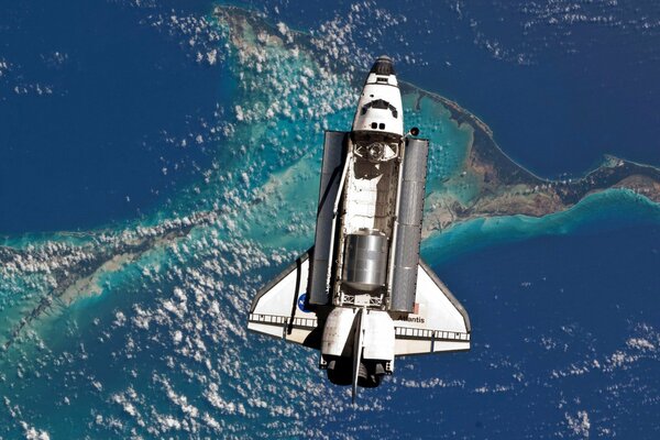 The space shuttle is operating in orbit