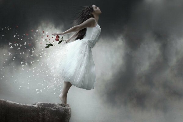 The flight of the soul. A girl in a white dress on a rock. Clouds. A storm of emotions. Falling off a cliff