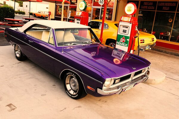 Purple Dodge at the gas station