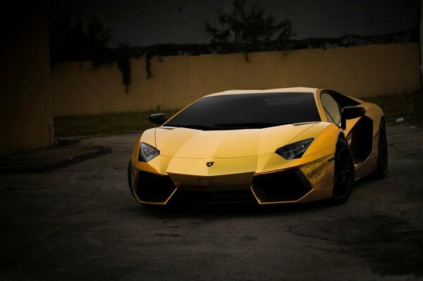 Golden Lamborghini rides down the street