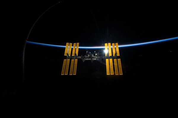 Space station in orbit black background