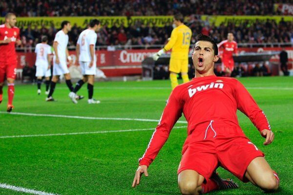 Ronaldo is on his knees on the field