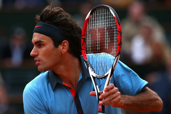 Roger Federer with a tennis racket