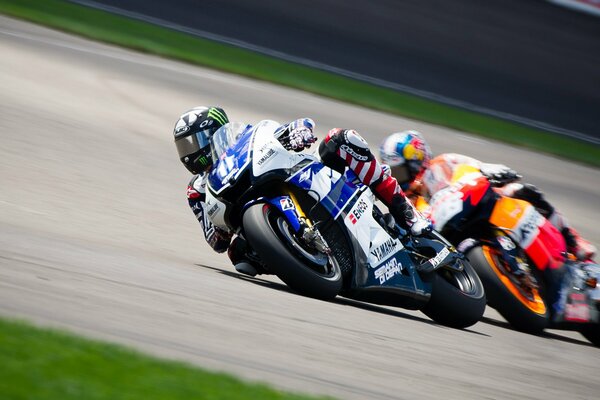 Motorcyclists enter the turn