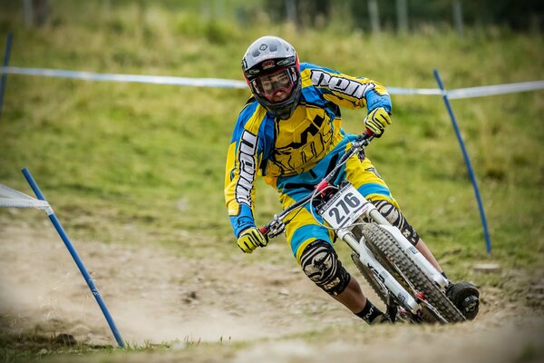 An athlete on a bicycle in equipment on the track