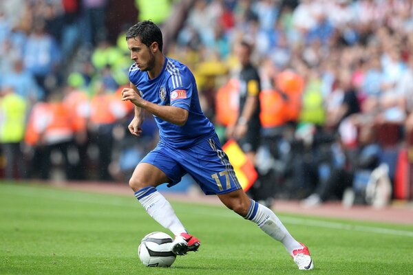 A man plays in a T-shirt at the stadium