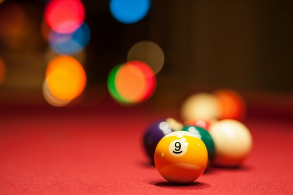 Billiard balls on the red table