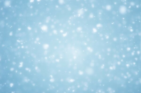 It s snowing white on a blue background