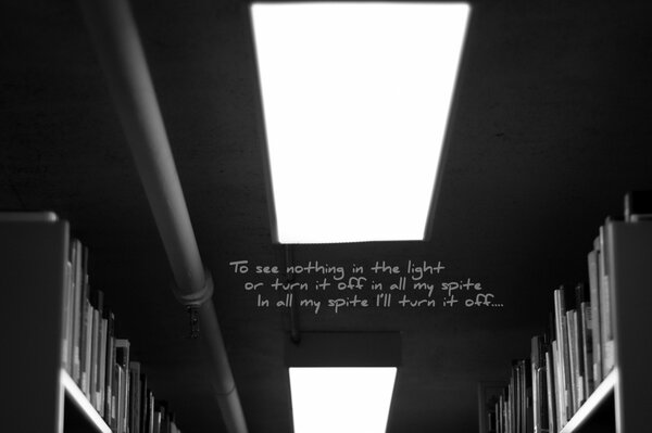 Cabinets with literature on the sides and a light on the ceiling and an inscription