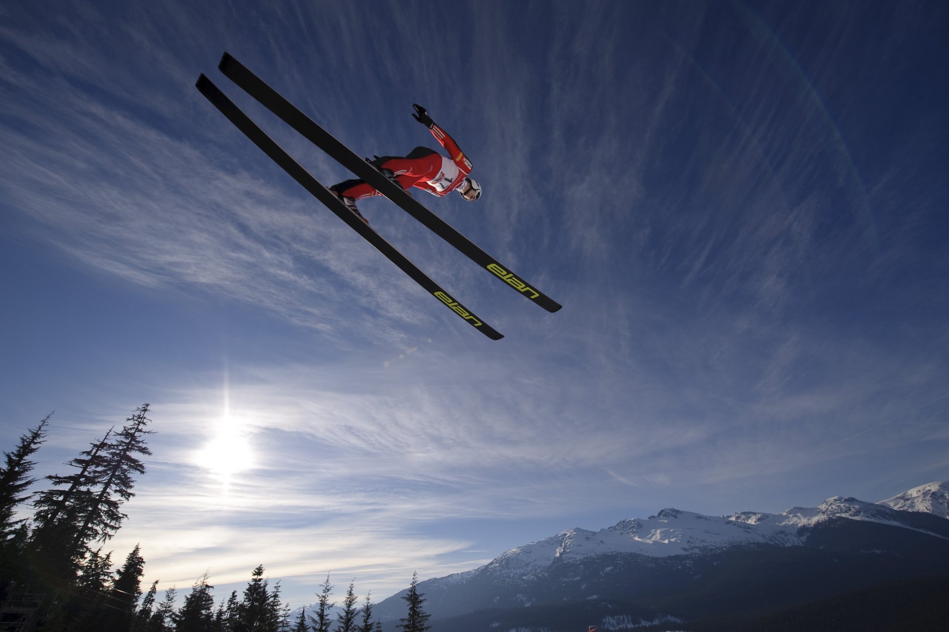 ki jumping winter mountains sun sky