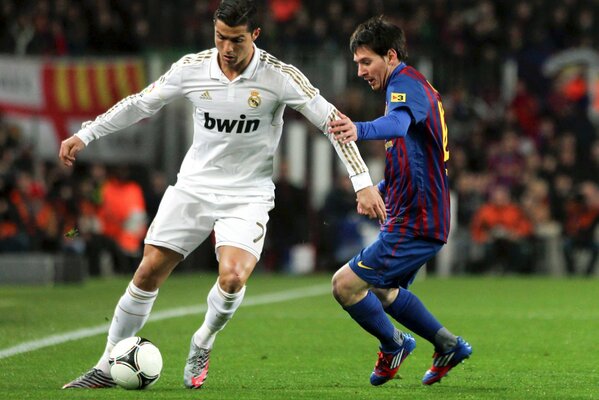 A football match with the touch of two men from different teams