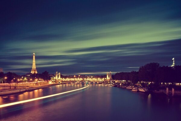 Eiffel Tower from the river side at night