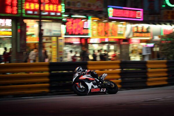 Biker rides very fast on a sports motorcycle