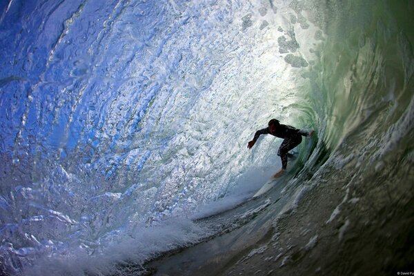 Surfing. The man in the wave on the board