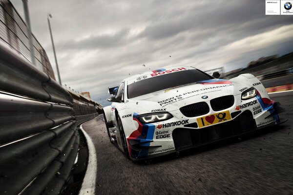 Racing car white on the track