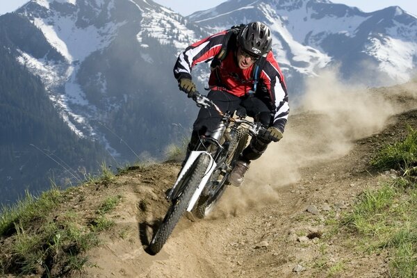 A man on a bike in the mountains