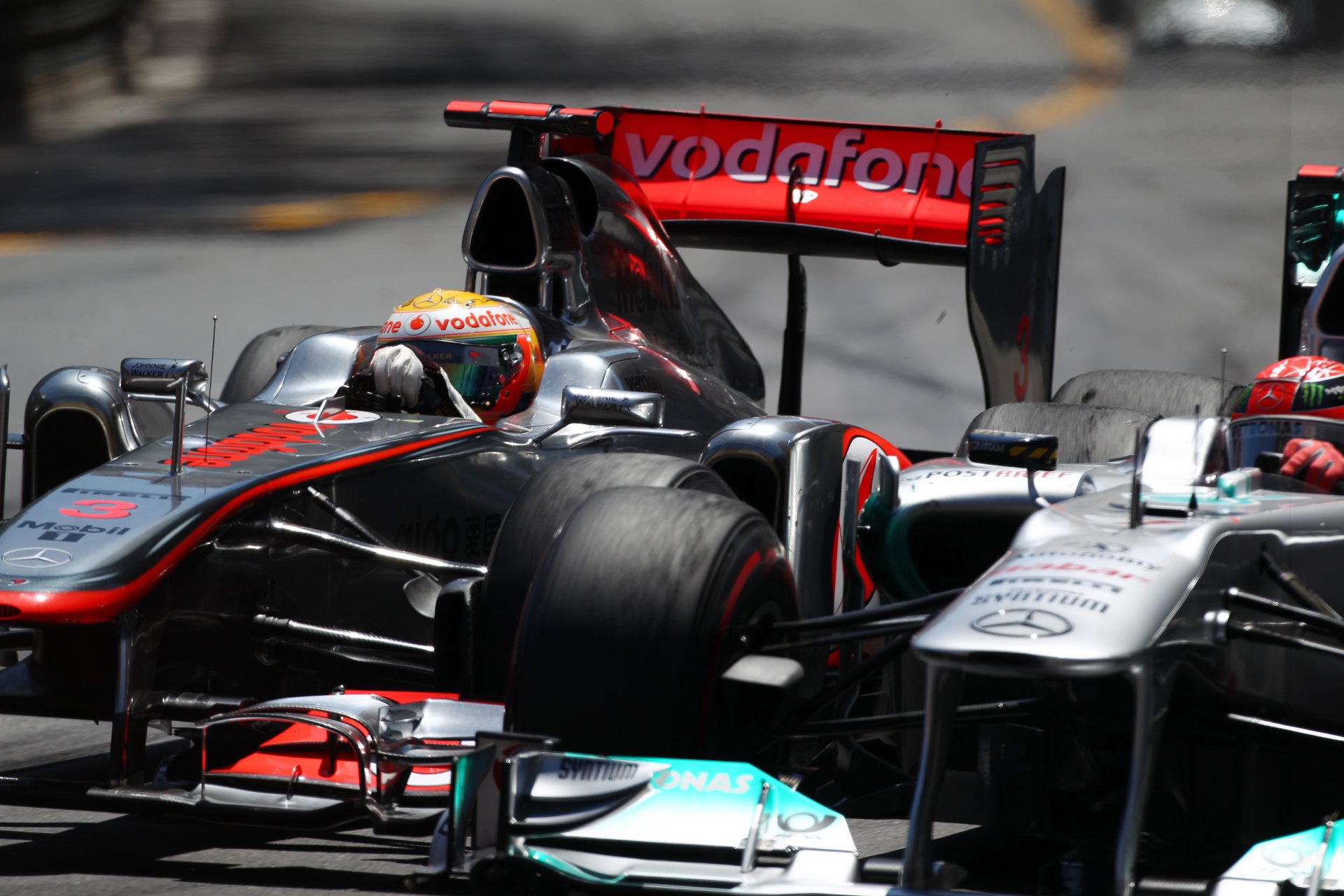 formula formula one f1 monaco 2011 mclaren lewis hamilton mercedes michael schumacher formula 1 mclaren lewis hamilton mercedes racer pilot track turn curb overtaking