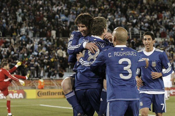 Happy Messi hugging team members