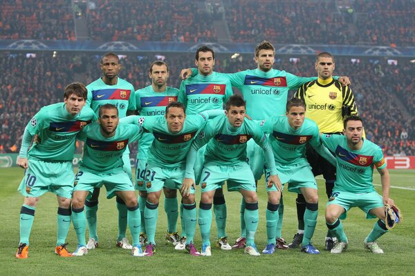 The football team is standing on the field. Shakhtar Barcelona 2011