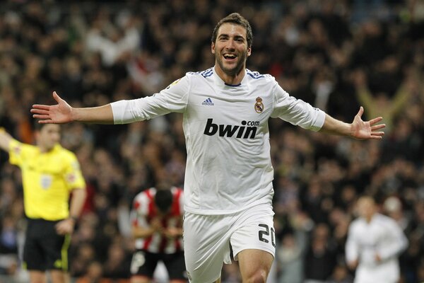 Happy football player from the Real Madrid team