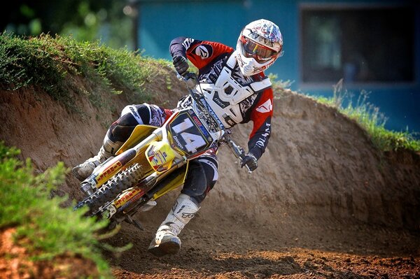 A motorcyclist on a motorcycle participates in competitions