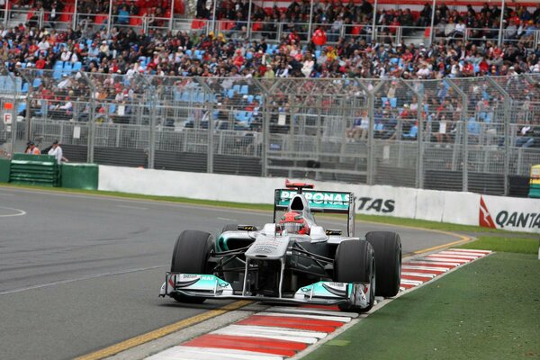 Racing car and fans in the background