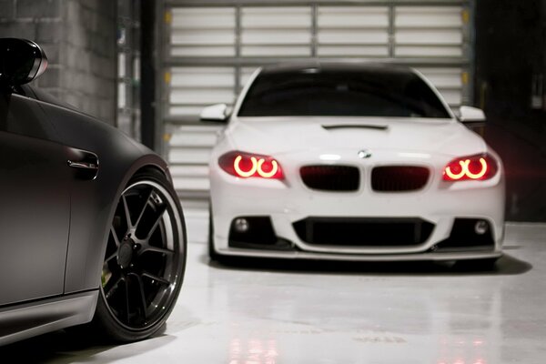 White BMW in the garage for the role of shutters