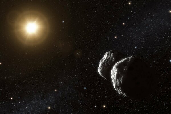 An asteroid on the background of a star in space in complete emptiness