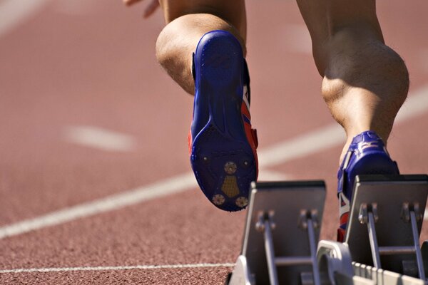 Legs of a sprinter who has just started