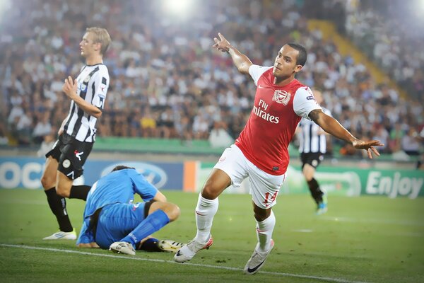 Footballeurs sur fond de stade