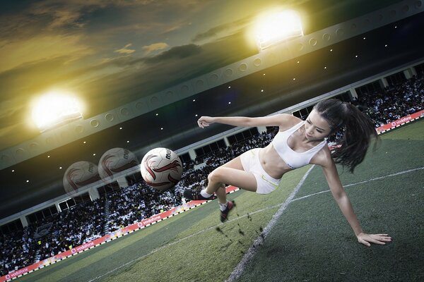 Chica en el fútbol patea la pelota en el vuelo