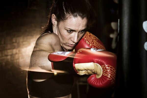 A girl in boxing training