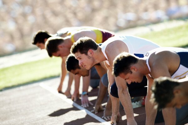 Athletes runners in T-shirts at the start