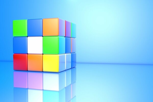 Cube de Rubik avec réflexion sur fond bleu
