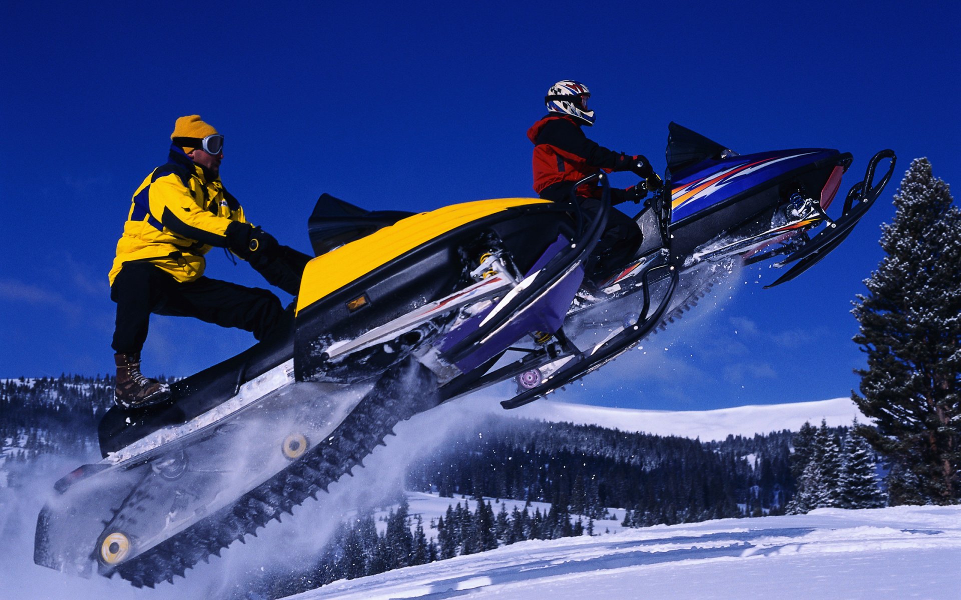 winter snowmobiles jump sky