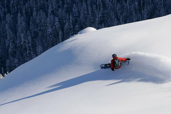 Extreme on a board with snow on the slope