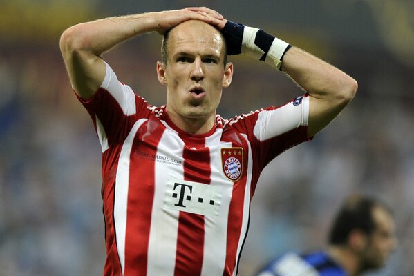 A football player fights for his head with both hands