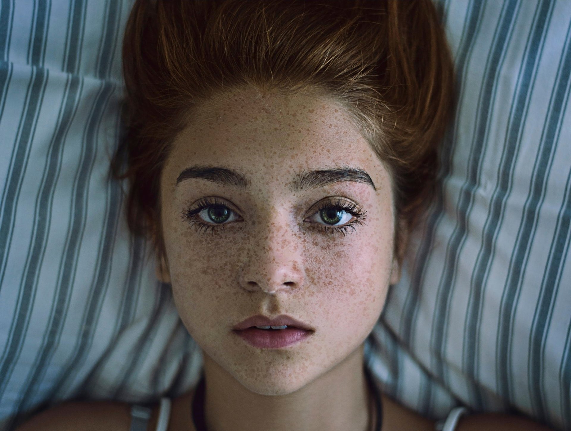 freckles red hair green-eyed portrait