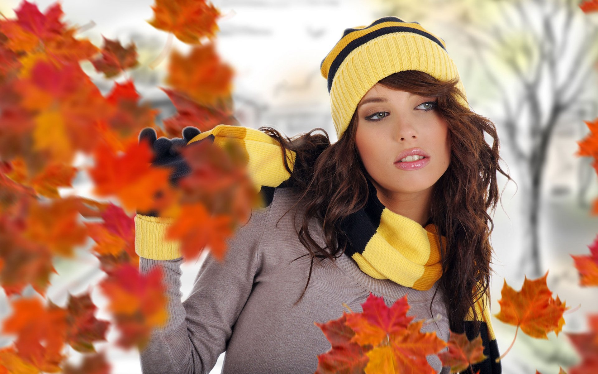 girl flying autumn leaves street