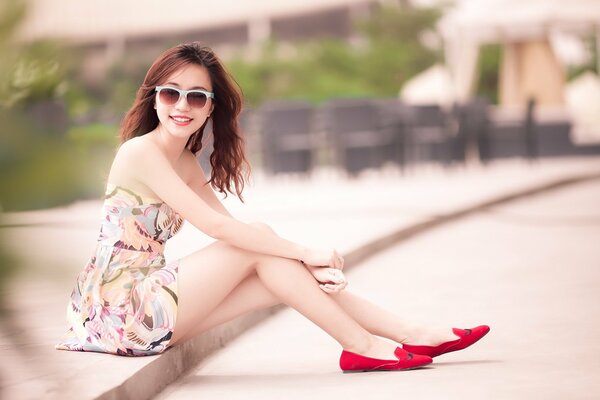 Beautiful Asian women in red shoes on the road