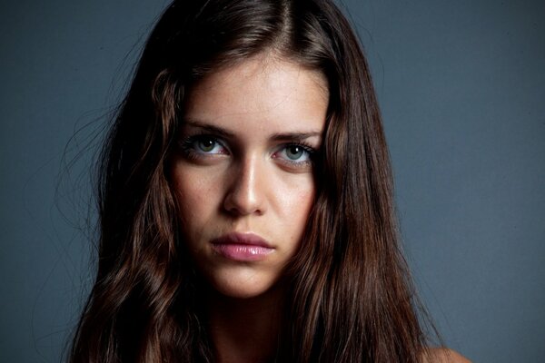 Portrait of a girl with brown hair and green eyes